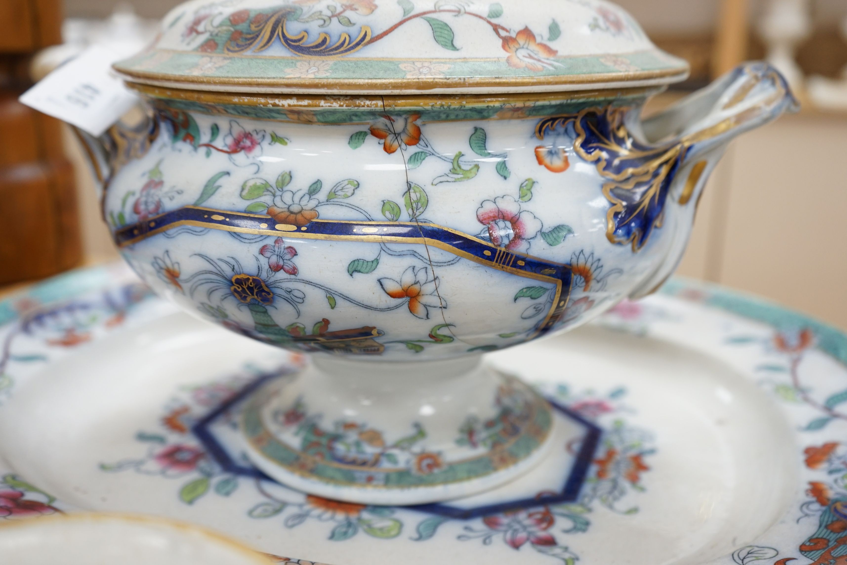 A mid 19th century Staffordshire pottery lidded soup tureen and cover (base cracked), a large meat dish and a sauce tureen (lacking lid) (3)